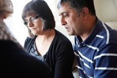 Concerned couple discussing issues with specialist