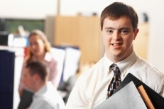 Young man with down syndrome looking at camera